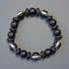 Bracelet en shungite, billes lisses 10 mm ±, rondelles 10×4 mm ±, longueur 18 cm, élastique