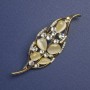Broche Feuille œil de chat et strass blancs, métal doré, 64×24 mm+