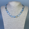 Collier en kyanite, perles ovales 12×9 mm (+/-), longueur environ 45 cm, avec fermoir