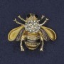 Broche Abeille dorée et marron, émail, strass blancs et noirs, métal doré, 25×30 mm+