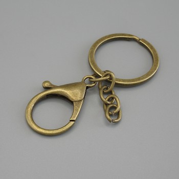 Prix par emballage / 10 pièces. Base pour porte-clés avec deux attaches, mousqueton 33×24 mm ± et anneau, diamètre 3 cm, longueur 7 cm