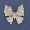 Broche-pendentif Papillon émail blanc, strass irisés, métal doré 39×42 mm+