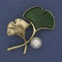 Broche en forme de brindille, couleur verte, perle sur métal doré 48×38 mm+