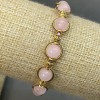 Bracelet quartz rose, perles rondes lisses de 8,5 mm ±, avec inserts métalliques, longueur 18 cm, élastique