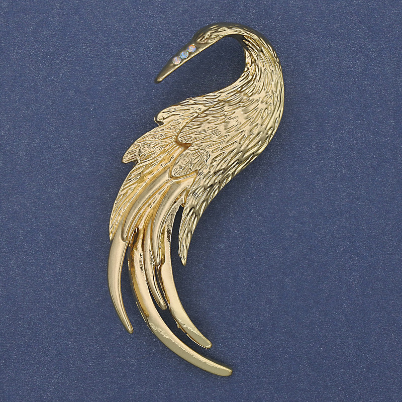 Broche «Oiseau de feu», strass blancs, métal doré, 60×37 mm+