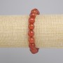 Bracelet en cornaline, boule facettée de 10 mm, longueur environ 18 cm, élastique