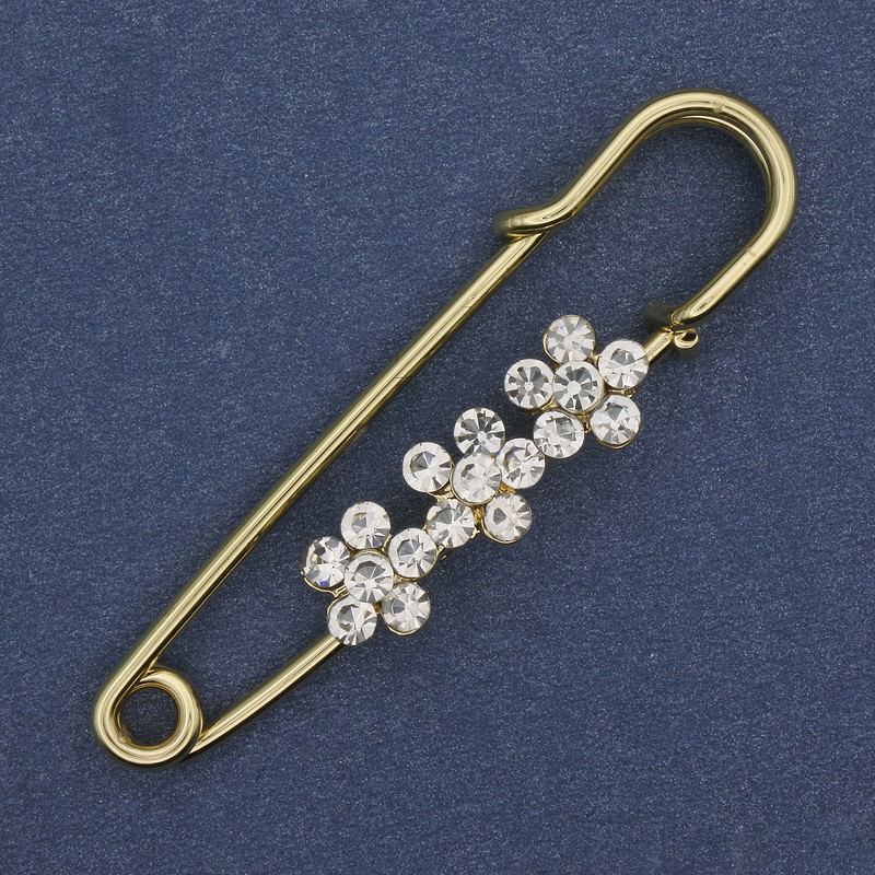 Broche-pince à strass blancs 48×10 mm ± métal doré