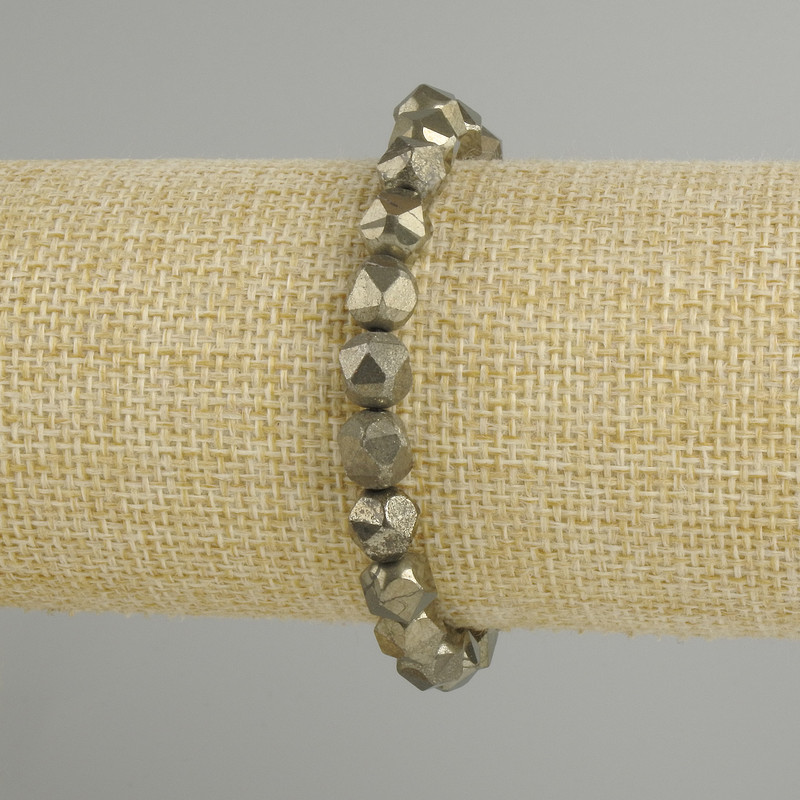 Bracelet en pyrite à facettes, diamètre 8×7 mm ±, longueur 18 cm ±, élastique
