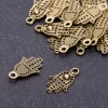 Pendentif Paume bronze, diamètre 12 mm, longueur 20 mm, trou Ø 3 mm, conditionnement 20 g ± 36 pièces