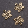 Pendentif papillon (bronze), diamètre 13 × 13 mm, diamètre 1,5 mm, conditionnement 20 g +/- 22 pièces