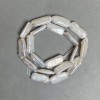 Perles baroques sur fil, reflets «benzine» couleur chaude, diamètre 10x21 mm, longueur 41 cm (+/-)