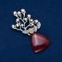 Broche en cornaline avec perle, 74 × 32 mm, métal argenté avec dorure