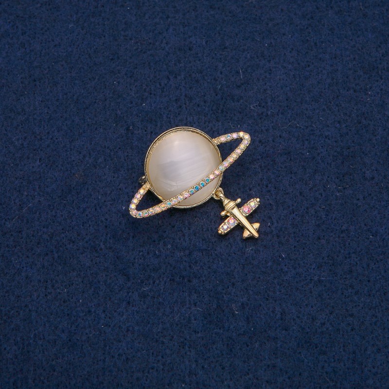 Broche Saturne avec œil de chat et strass