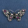 Broche papillon, strass multicolores, métal argenté 70 × 39 mm