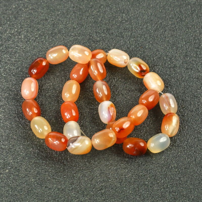 Perles de cornaline lisses sur fil en forme de tonneau 10×14 mm