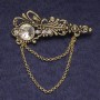 Broche Accent, strass blancs et cristal, métal doré 55×22 mm